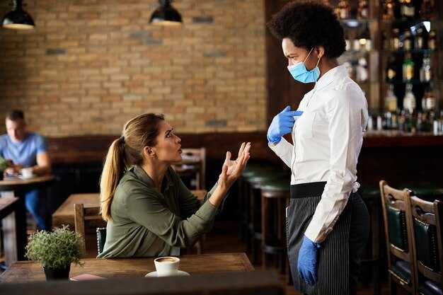 Verify hotel safety policies and room service contact procedures before ordering