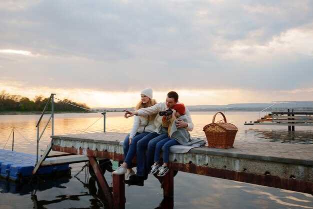 Authentic dining environment: boat-style seating, lantern light, and canal ambience